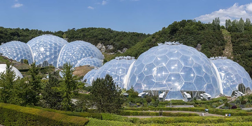 View of biomes at the Eden Project in Cornwall, with a rainbow in the sky above