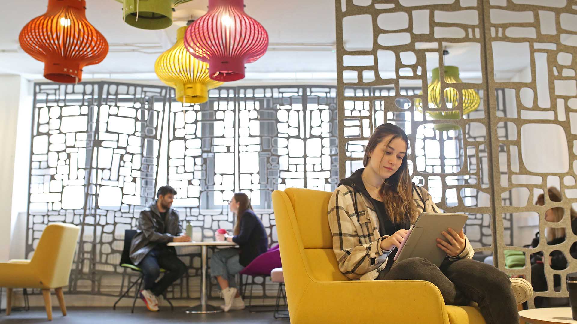 University students relaxing in a social space on campus