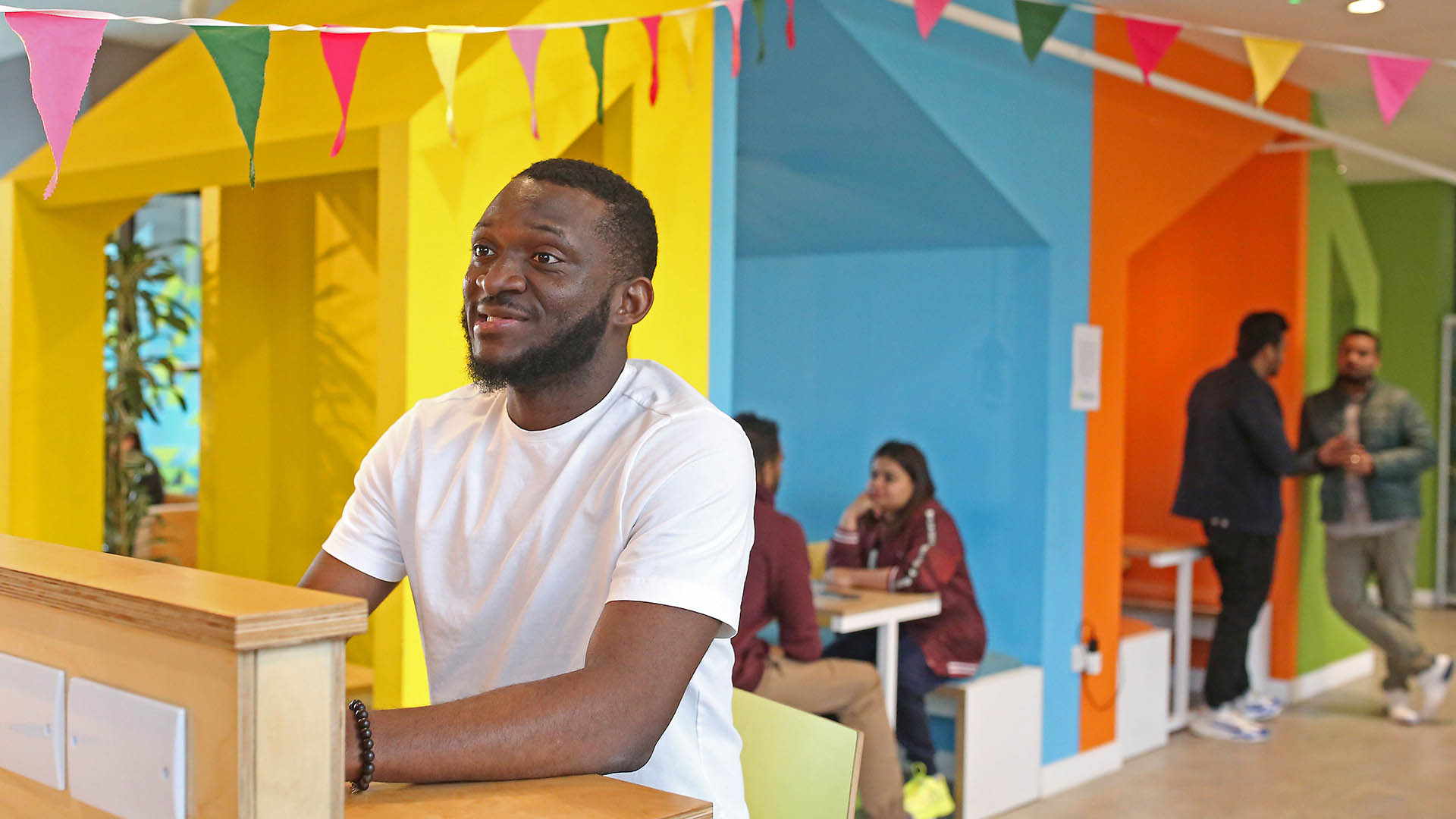 Small groups of students chatting in a Students' Union social space