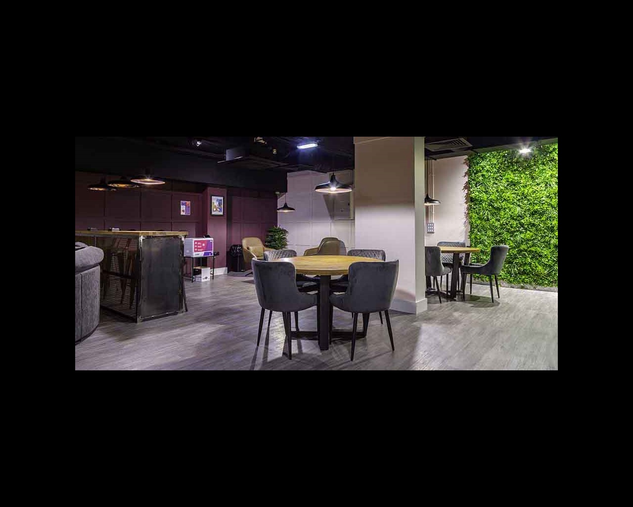 Chairs clustered around tables in Cambridge's CB1 accommodation