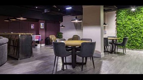 Chairs clustered around tables in Cambridge's CB1 accommodation