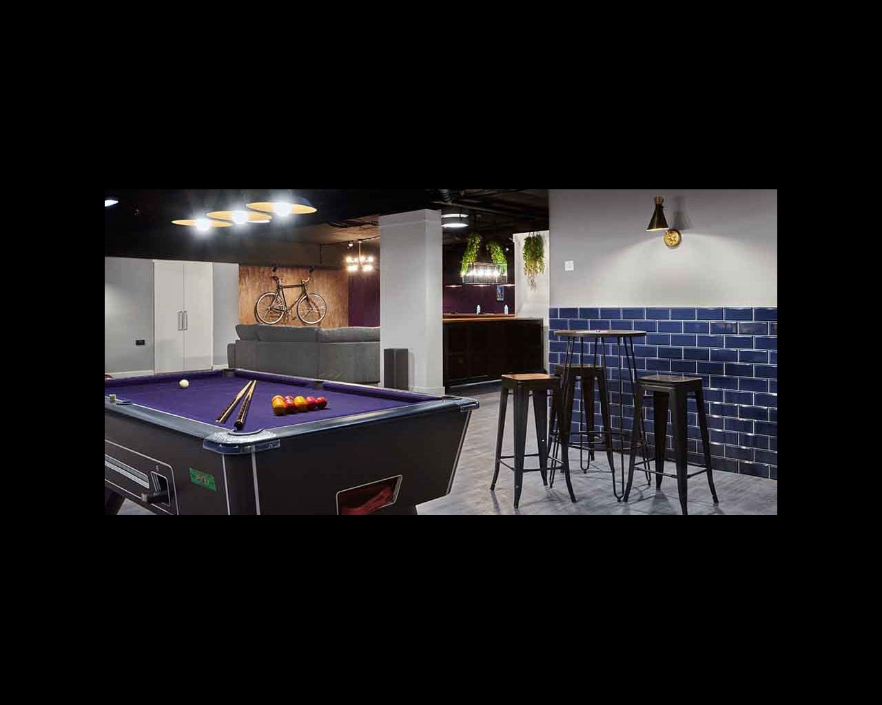 A pool table and breakfast bar in Cambridge's CB1 accommodation