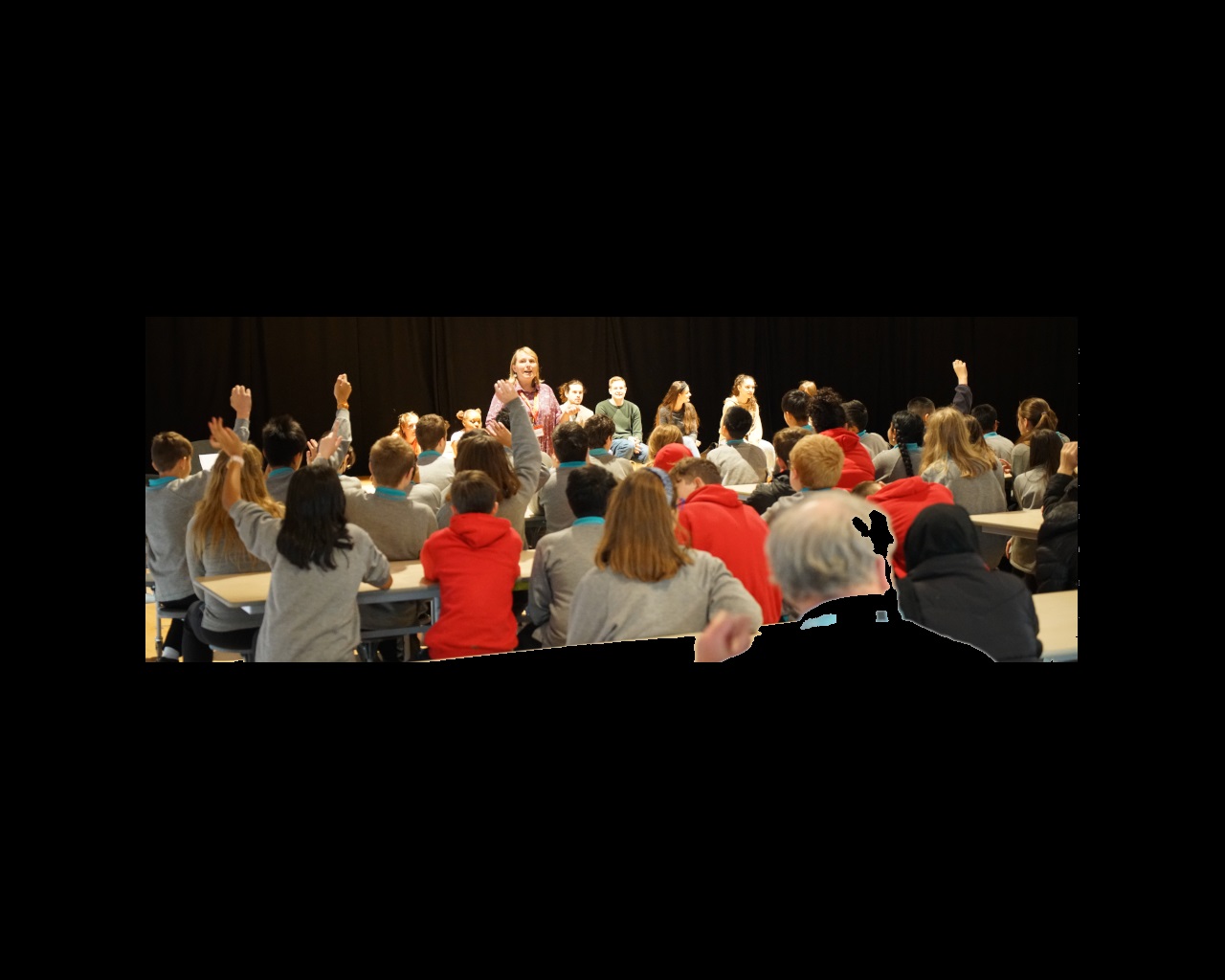 Heather Lilley and students on stage taking questions from audience