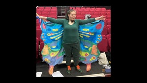 Female student wearing butterfly wings