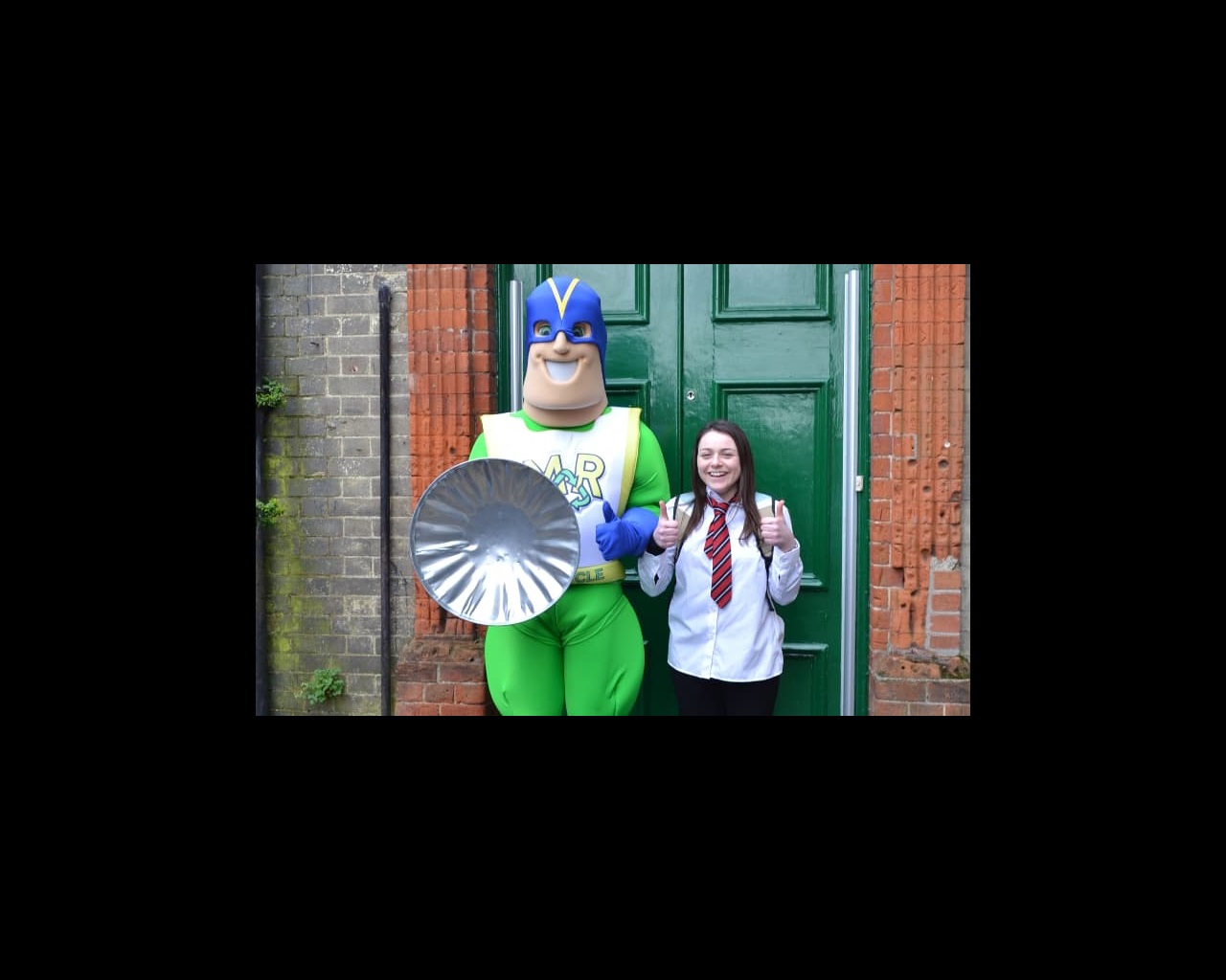 Michael the Recycling Superhero in costume with student actor Laura Mackay