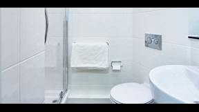 Detail of bathroom with shower, basin and toilet