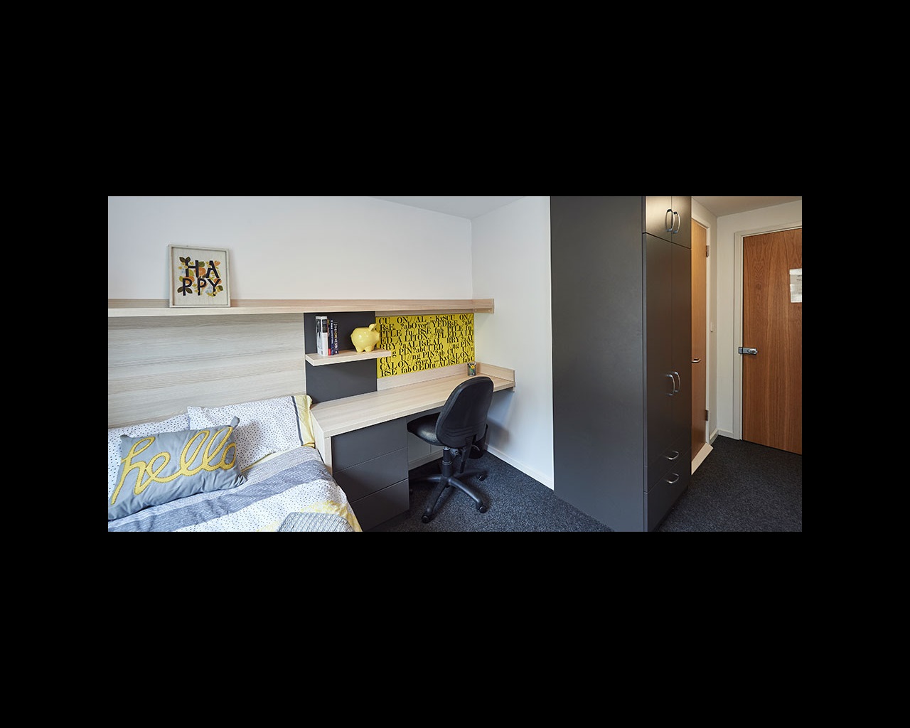 Bedroom with desk space and storage