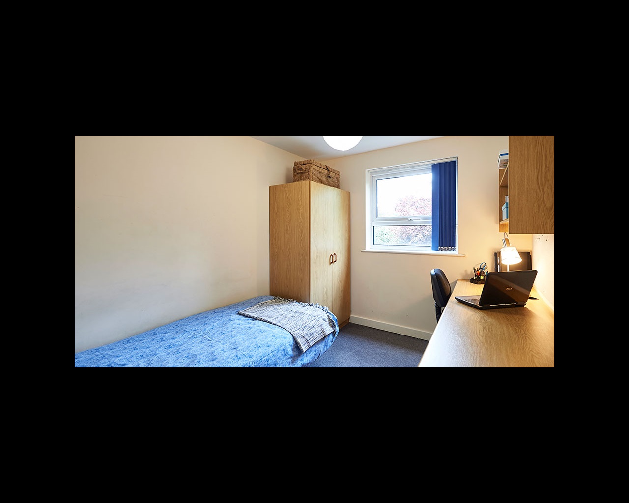 Bedroom with wardrobe and desk space