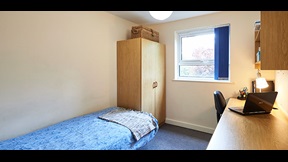 Bedroom with wardrobe and desk space