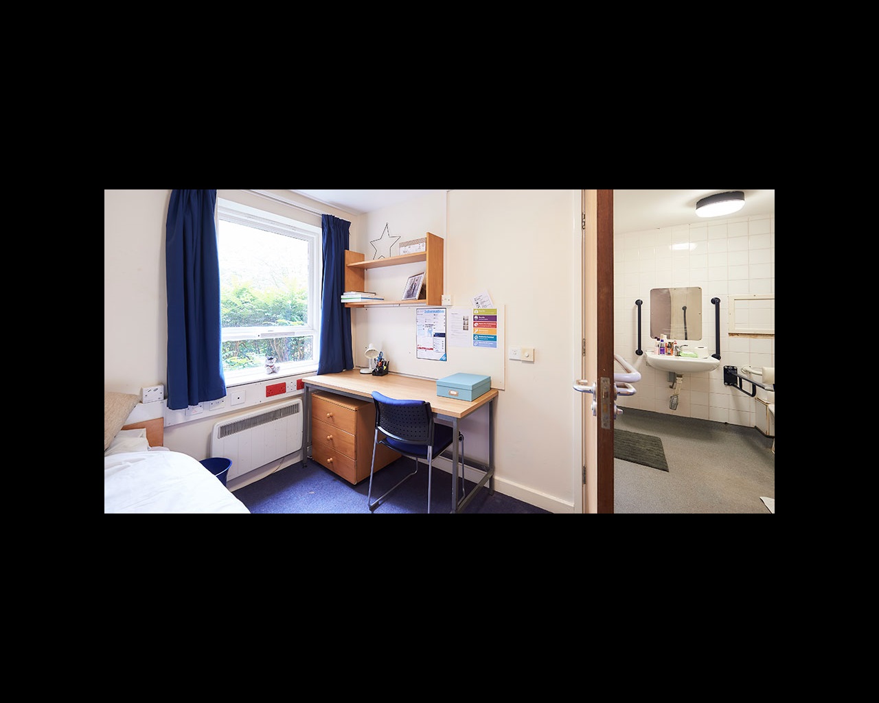 Bedroom with door into adapted bathroom