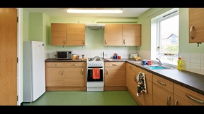 Kitchen with fitted units, fridge freezer and oven