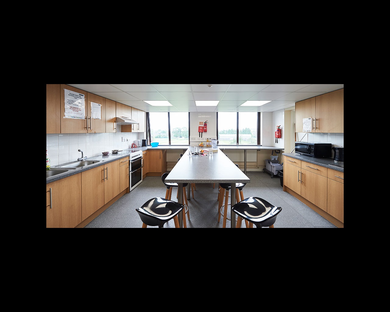 Kitchen with bar stools and built-in table